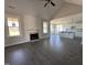 Expansive living room with wood flooring, fireplace, and an open concept layout leading to the kitchen at 141 Ruskin Dr, Smithfield, NC 27577