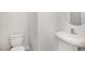 Clean, half bathroom with simple fixtures and a pedestal sink at 15 Woodworkers Way, Clayton, NC 27520