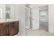 Bathroom featuring vanity, glass-enclosed shower, and access to the bedroom at 15 Woodworkers Way, Clayton, NC 27520