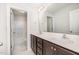 Bright bathroom featuring double sinks, stylish vanity, and shower with white tiled walls at 15 Woodworkers Way, Clayton, NC 27520