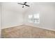 Bright bedroom with a ceiling fan, carpeted floors, and a large window at 15 Woodworkers Way, Clayton, NC 27520