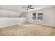 Cozy bedroom featuring carpeted floors and a bright window with pleasant neighborhood views at 15 Woodworkers Way, Clayton, NC 27520