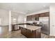 Modern kitchen boasts granite countertops, stainless steel appliances, and a spacious center island at 15 Woodworkers Way, Clayton, NC 27520