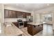 Well-equipped kitchen features granite countertops, stainless steel appliances, and an island with storage at 15 Woodworkers Way, Clayton, NC 27520
