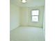 A bright, airy bedroom featuring a large window with natural light at 1725 Mallard Trace Dr, Wendell, NC 27591