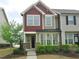 Inviting two-story home showcasing a well-manicured lawn and a cozy front porch at 1725 Mallard Trace Dr, Wendell, NC 27591