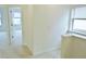 Hallway with neutral carpet leads to bedrooms with abundant natural light at 1725 Mallard Trace Dr, Wendell, NC 27591