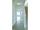 Hallway with views to living area features carpeted stairs and vinyl plank flooring at 1725 Mallard Trace Dr, Wendell, NC 27591