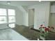 Bright living room features hardwood floors, modern ceiling fan and plentiful natural light from the windows at 1725 Mallard Trace Dr, Wendell, NC 27591