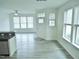 Bright living room features hardwood floors, modern ceiling fan and plentiful natural light from the windows at 1725 Mallard Trace Dr, Wendell, NC 27591