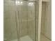 Bathroom shower with tiled surround and a linen closet with shelving at 1725 Mallard Trace Dr, Wendell, NC 27591