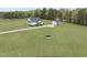 Expansive property featuring a lovely home, detached garage, and a buffalo statue on a sprawling green lawn at 184 Mort Harris Rd, Louisburg, NC 27549