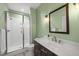 Bathroom featuring a glass enclosed shower and a modern vanity at 184 Mort Harris Rd, Louisburg, NC 27549