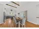 Bright dining area featuring vaulted ceilings with wooden beams, hardwood floors, and an open flow to the kitchen at 184 Mort Harris Rd, Louisburg, NC 27549