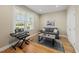 Cozy living room with a large window, sofa, stylish rug, and a piano at 184 Mort Harris Rd, Louisburg, NC 27549
