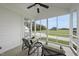 Enjoy the outdoors on this screened in porch with comfortable seating and views of the expansive yard at 184 Mort Harris Rd, Louisburg, NC 27549