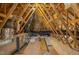 Open attic features exposed wooden beams and rafters at 198 Ruskin Dr, Smithfield, NC 27577