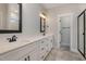 Double vanity bathroom with dual sinks, modern fixtures and a walk in shower at 198 Ruskin Dr, Smithfield, NC 27577