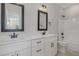 Well-lit bathroom with double vanity, modern fixtures, and a shower-tub combo at 198 Ruskin Dr, Smithfield, NC 27577
