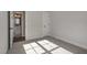 Bright bedroom boasts neutral walls, a door, and carpeted floors at 198 Ruskin Dr, Smithfield, NC 27577