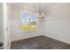 Bright dining area with a modern chandelier and views of the outdoors at 198 Ruskin Dr, Smithfield, NC 27577