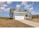 Charming single Gathering home has stone accents with large two car garage and well maintained lawn at 198 Ruskin Dr, Smithfield, NC 27577