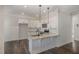 Modern kitchen features granite countertops, stainless steel appliances, and white cabinetry at 198 Ruskin Dr, Smithfield, NC 27577