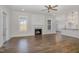Comfortable living room with ceiling fan, fireplace and access to kitchen at 198 Ruskin Dr, Smithfield, NC 27577