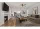 Staged living room with fireplace, couches and access to kitchen at 198 Ruskin Dr, Smithfield, NC 27577