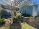 Lush backyard with a stone path, raised garden bed, and vibrant landscaping at 1980 Great Ridge Pkwy, Chapel Hill, NC 27516