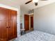 Comfortable bedroom with two wooden doors, chair, and ceiling fan at 1980 Great Ridge Pkwy, Chapel Hill, NC 27516
