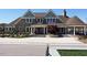 Clubhouse exterior featuring meticulous landscaping and covered porch at 1980 Great Ridge Pkwy, Chapel Hill, NC 27516