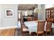 Elegant dining area with hardwood floors and view of the modern kitchen at 1980 Great Ridge Pkwy, Chapel Hill, NC 27516