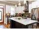 Modern kitchen features a center island, stainless steel appliances, and mosaic tile backsplash at 1980 Great Ridge Pkwy, Chapel Hill, NC 27516
