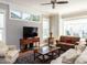Cozy living room showcasing large windows, hardwood floors, and an inviting seating area at 1980 Great Ridge Pkwy, Chapel Hill, NC 27516
