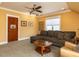 Inviting living room with yellow walls, cozy seating, and stylish decor at 1980 Great Ridge Pkwy, Chapel Hill, NC 27516