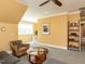 Comfortable living area with yellow walls, cozy seating, and a well-lit atmosphere at 1980 Great Ridge Pkwy, Chapel Hill, NC 27516