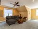 Inviting living room with yellow walls, cozy seating, and large window at 1980 Great Ridge Pkwy, Chapel Hill, NC 27516