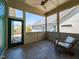 Cozy screened-in porch with tile floor, a comfortable chair and view of the backyard at 1980 Great Ridge Pkwy, Chapel Hill, NC 27516