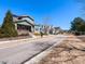 Street view of a charming two-story home with a front porch and landscaped yard in a residential neighborhood at 1980 Great Ridge Pkwy, Chapel Hill, NC 27516