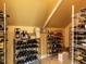 Organized wine cellar with multiple racks displaying a variety of wine bottles at 1980 Great Ridge Pkwy, Chapel Hill, NC 27516