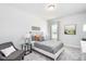 Comfortable bedroom featuring a soft bed with decorative pillows and ample natural light at 206 Drayton Hall Ln, Sanford, NC 27330