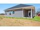Charming home featuring neutral siding, white trim, and a well-manicured lawn at 206 Drayton Hall Ln, Sanford, NC 27330