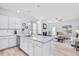 Open concept kitchen with a large island, stainless steel sink, and view of the living room at 206 Drayton Hall Ln, Sanford, NC 27330