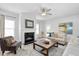 Bright living room with fireplace, neutral tones and comfortable furniture at 206 Drayton Hall Ln, Sanford, NC 27330