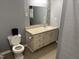 Cozy bathroom featuring a vanity with storage and a neutral color scheme, perfect for a simple design at 2102 Michael Ln, Smithfield, NC 27577