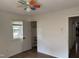 Bright bedroom with laminate flooring, ceiling fan, closet, and natural light from a window at 2102 Michael Ln, Smithfield, NC 27577
