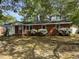 Charming single-story brick home with mature trees and landscaping, offering curb appeal at 2102 Michael Ln, Smithfield, NC 27577