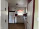 Charming kitchen featuring white cabinetry, modern appliances, and a window with a view at 2102 Michael Ln, Smithfield, NC 27577