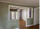 View of a living room with French doors leading to the porch, wood floors, and colorful walls at 2102 Michael Ln, Smithfield, NC 27577